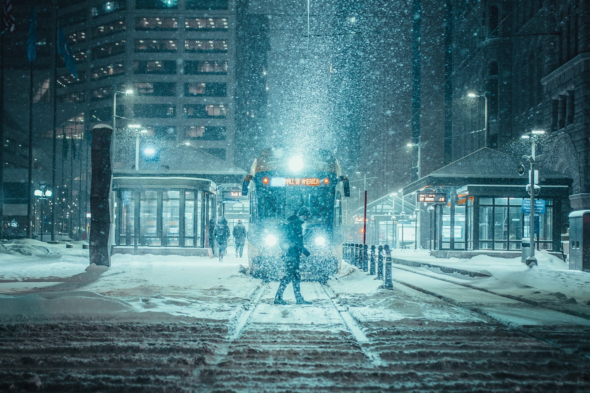 Person Standing in Front of a Train